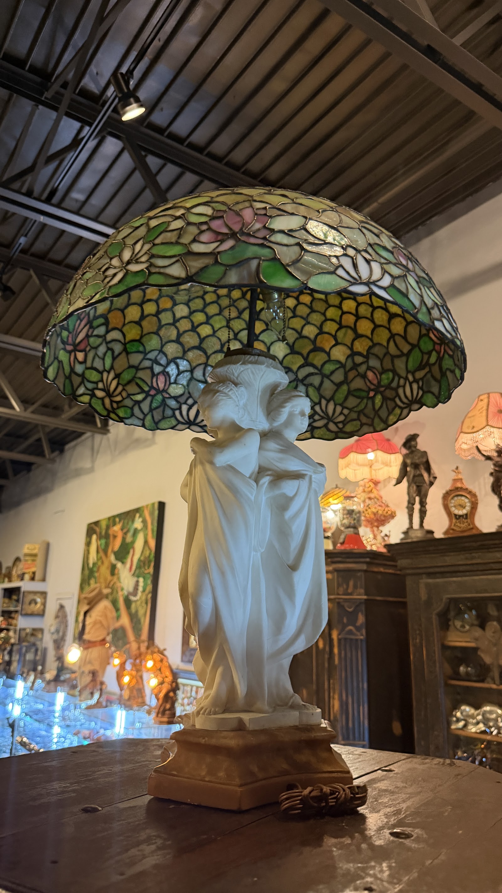 Leaded-glass lamp on an alabaster figure